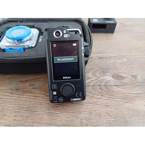 655 - Four digital action cameras, one Nikon KeyMission 80 waterproof/shockproof Bluetooth/wi-fi, one wate... 