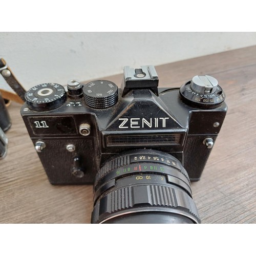 656 - Three KMZ Zenit 35mm SLR cameras, one E body, one B fitted with Helios-44-2 2/58 lens and one 11 fit... 