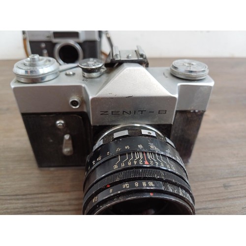 656 - Three KMZ Zenit 35mm SLR cameras, one E body, one B fitted with Helios-44-2 2/58 lens and one 11 fit... 