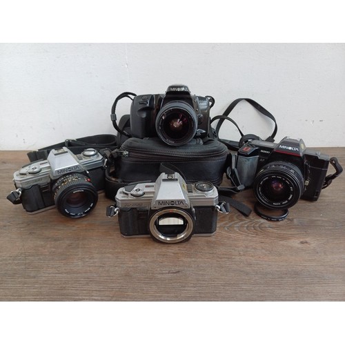 657 - Four Minolta 35mm SLR cameras, one X-300 body, one X-300 fitted with MD1:1.7 50mm lens, one 5000 fit... 