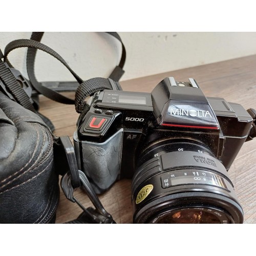 657 - Four Minolta 35mm SLR cameras, one X-300 body, one X-300 fitted with MD1:1.7 50mm lens, one 5000 fit... 