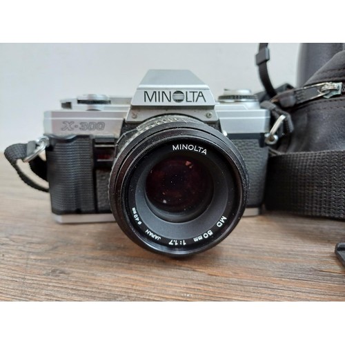 657 - Four Minolta 35mm SLR cameras, one X-300 body, one X-300 fitted with MD1:1.7 50mm lens, one 5000 fit... 