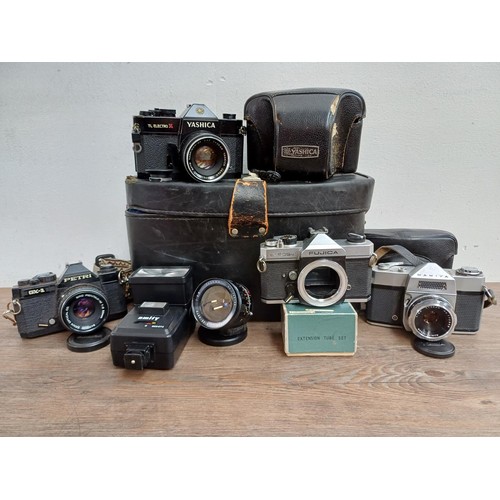 659 - Four Japanese 35mm SLR cameras, one Petri GX-1 fitted with Pentax-M 1:2 50mm lens, one Fujica ST605N... 