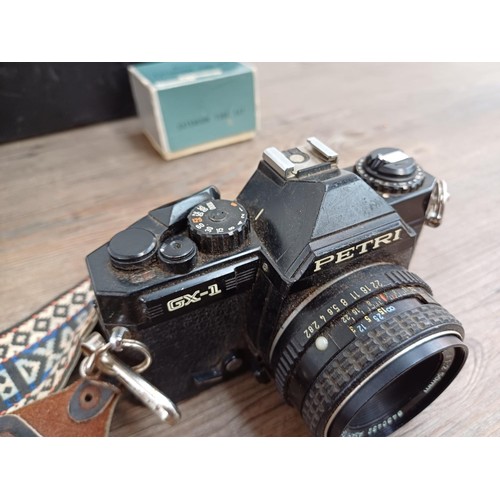 659 - Four Japanese 35mm SLR cameras, one Petri GX-1 fitted with Pentax-M 1:2 50mm lens, one Fujica ST605N... 