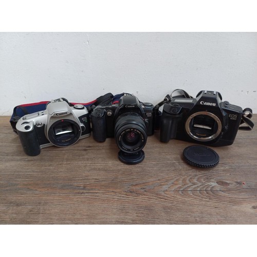 660 - Three Canon EOS autofocus 35mm SLR cameras, one 650 body with Quartz Date Back E, one 500 fitted wit... 