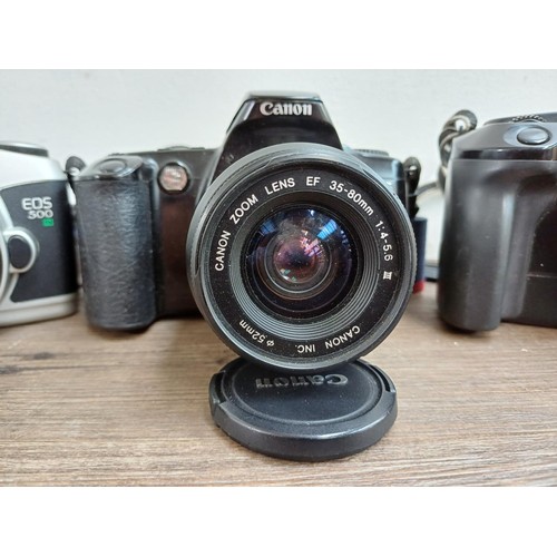 660 - Three Canon EOS autofocus 35mm SLR cameras, one 650 body with Quartz Date Back E, one 500 fitted wit... 