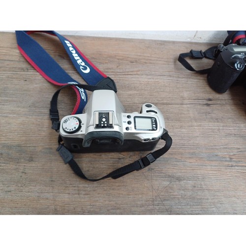 660 - Three Canon EOS autofocus 35mm SLR cameras, one 650 body with Quartz Date Back E, one 500 fitted wit... 