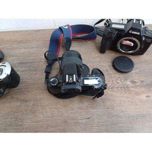 660 - Three Canon EOS autofocus 35mm SLR cameras, one 650 body with Quartz Date Back E, one 500 fitted wit... 