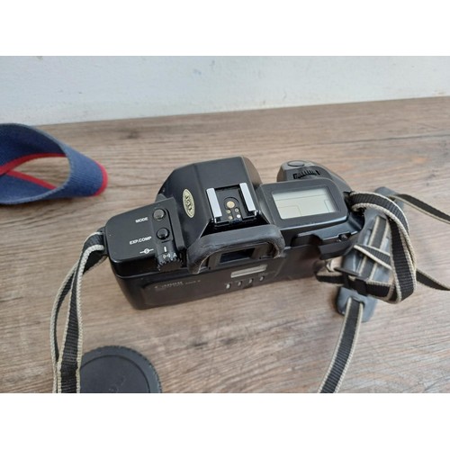 660 - Three Canon EOS autofocus 35mm SLR cameras, one 650 body with Quartz Date Back E, one 500 fitted wit... 