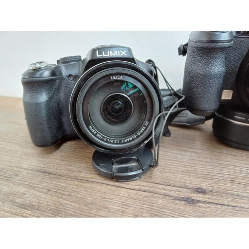 664 - Four compact digital bridge cameras, one Panasonic DMC-FZ200, one Fujifilm FinePix S1730 12mp, one F... 