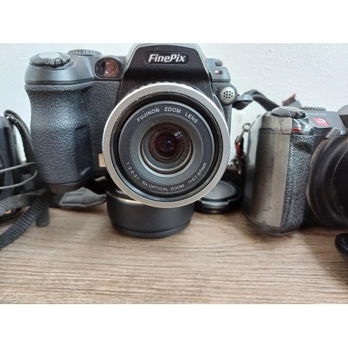 664 - Four compact digital bridge cameras, one Panasonic DMC-FZ200, one Fujifilm FinePix S1730 12mp, one F... 