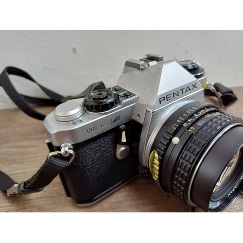 667 - A cased Pentax ME Super 35mm SLR camera fitted with Pentax-M 1:1.7 50mm lens