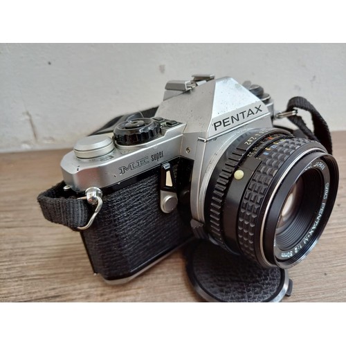 668 - A cased Pentax ME Super 35mm SLR camera fitted with Pentax-M 1:2 50mm lens