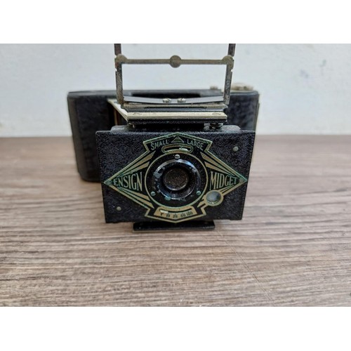 670 - A cased 1930s Houghton-Butcher Ensign Midget A/D model 33 strut folding miniature camera for Ensign ... 