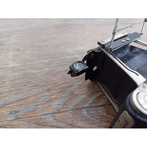 670 - A cased 1930s Houghton-Butcher Ensign Midget A/D model 33 strut folding miniature camera for Ensign ... 