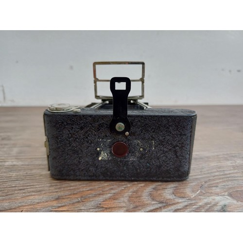 670 - A cased 1930s Houghton-Butcher Ensign Midget A/D model 33 strut folding miniature camera for Ensign ... 