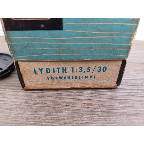 673 - A boxed mid 20th century Meyer-Optik Lydith 3.5/30 lens