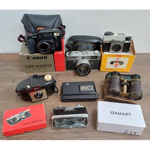 677 - A collection of cameras and binoculars to include cased Canon Canonet QL19 35mm rangefinder camera, ... 