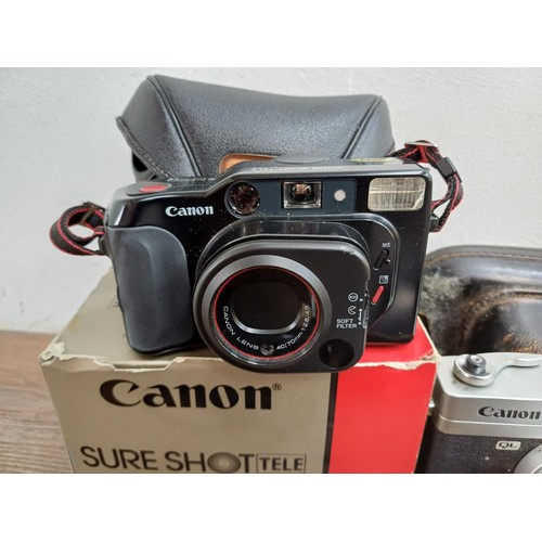 677 - A collection of cameras and binoculars to include cased Canon Canonet QL19 35mm rangefinder camera, ... 