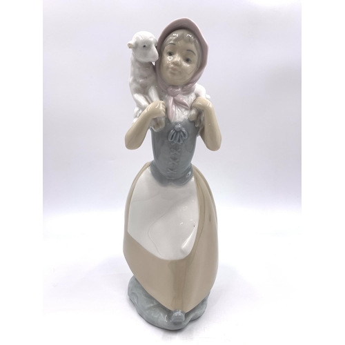 309 - Three Nao porcelain figurines - largest approx. 25cm high