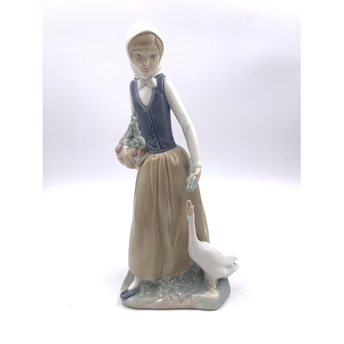 309 - Three Nao porcelain figurines - largest approx. 25cm high