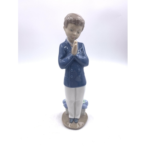 311 - Six Nao and Lladro porcelain figurines - largest approx. 22cm high