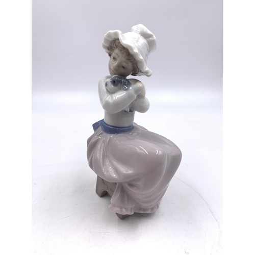 311 - Six Nao and Lladro porcelain figurines - largest approx. 22cm high