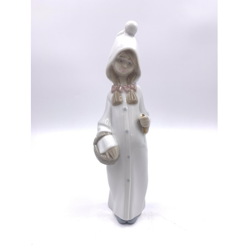 311 - Six Nao and Lladro porcelain figurines - largest approx. 22cm high