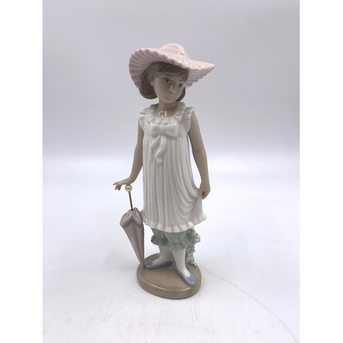 311 - Six Nao and Lladro porcelain figurines - largest approx. 22cm high