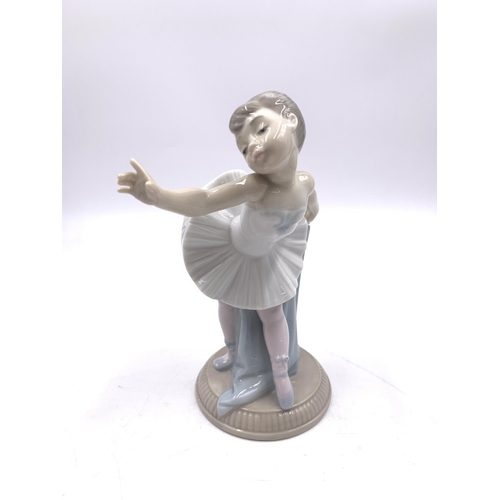 311 - Six Nao and Lladro porcelain figurines - largest approx. 22cm high