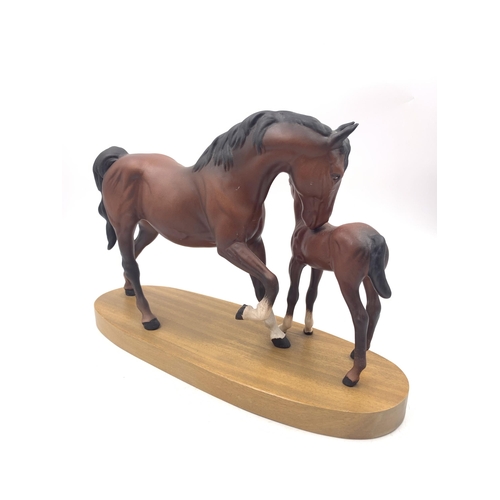 315 - A Beswick 'Spirit of Affection' horse figurine on wooden plinth - approx. 20cm high x 32cm long