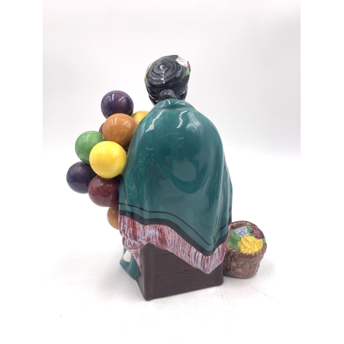 320 - A Royal Doulton The Old Balloon Seller figurine - HN1315