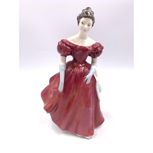 334 - Four Royal Doulton figurines, Autumn Breezes HN1934, Winsome HN2220, Natalie HN3173 and Janine HN246... 