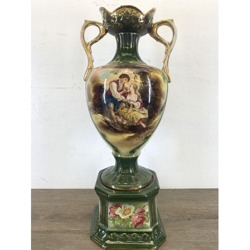 336 - A Victorian style transfer printed and hand decorated pottery twin handled vase - approx. 54cm high