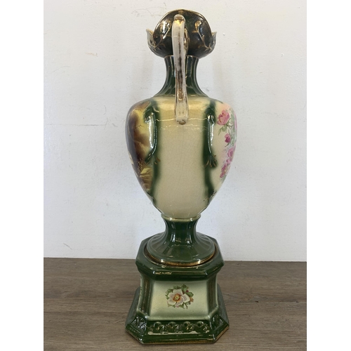 336 - A Victorian style transfer printed and hand decorated pottery twin handled vase - approx. 54cm high