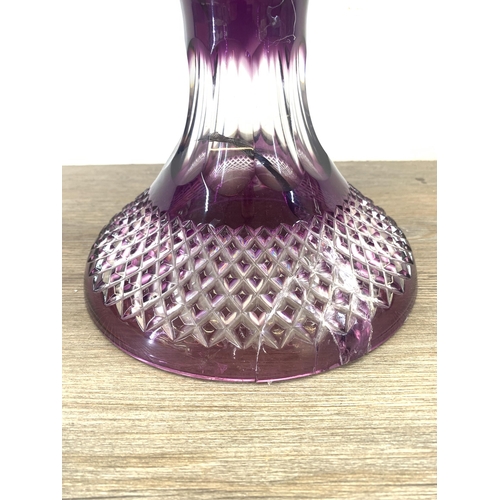 342 - A Bohemian amethyst cut crystal pedestal vase - approx. 49.5cm high