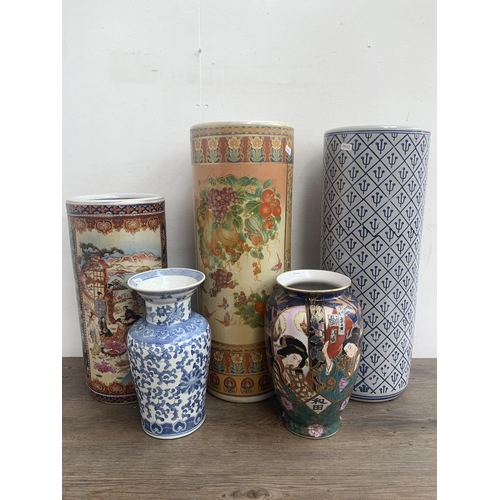 360 - Five oriental ceramic items, three stick stands and two vases - largest approx. 62cm high