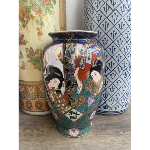 360 - Five oriental ceramic items, three stick stands and two vases - largest approx. 62cm high