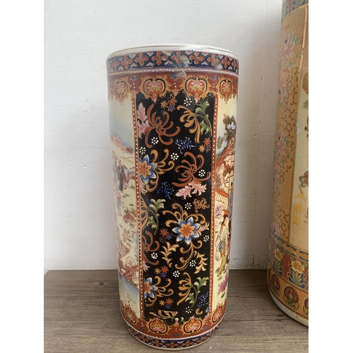 360 - Five oriental ceramic items, three stick stands and two vases - largest approx. 62cm high