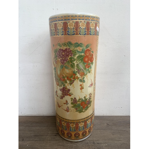 360 - Five oriental ceramic items, three stick stands and two vases - largest approx. 62cm high