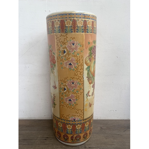 360 - Five oriental ceramic items, three stick stands and two vases - largest approx. 62cm high