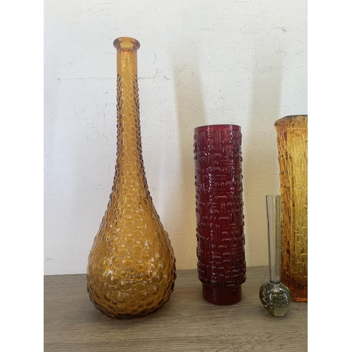 366 - Five pieces of mid 20th century glassware to include Emil Funke red vase, two Empoli genie bottles e... 