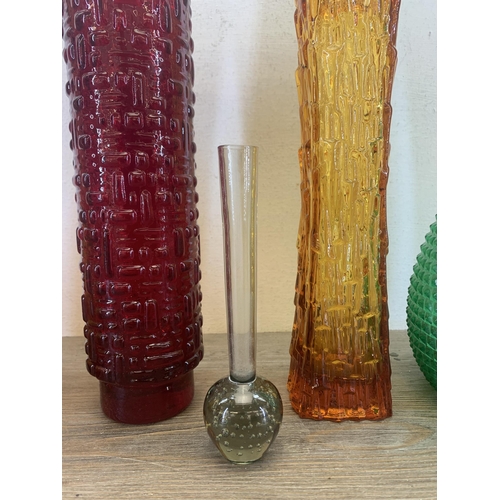 366 - Five pieces of mid 20th century glassware to include Emil Funke red vase, two Empoli genie bottles e... 