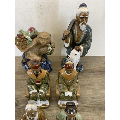 372 - Eight Chinese porcelain figurines - largest approx. 37cm high