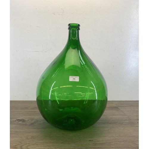 378 - A vintage French green glass carboy - approx. 48cm high