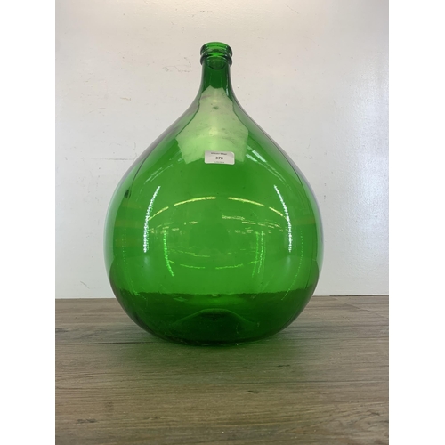 378 - A vintage French green glass carboy - approx. 48cm high