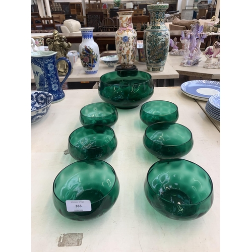 383 - Seven green glass bowls - largest approx. 20cm diameter