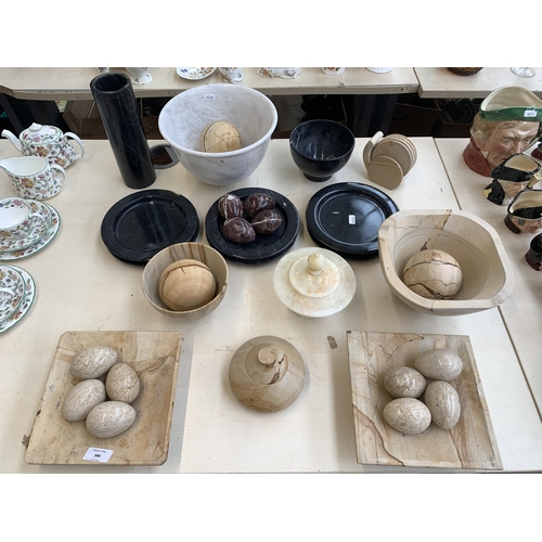 386 - A collection of natural stone tableware to include onyx, marble etc.