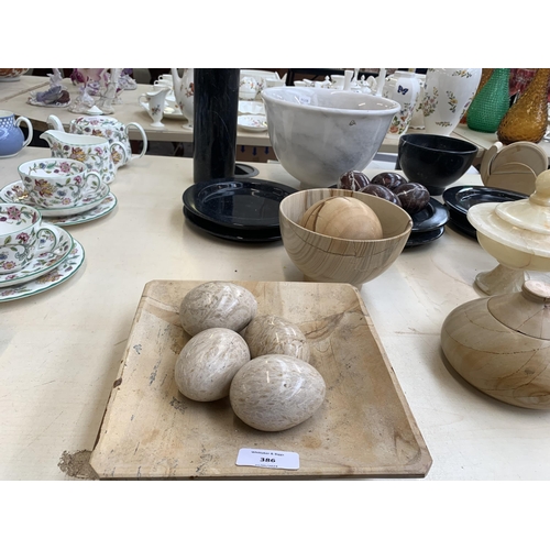 386 - A collection of natural stone tableware to include onyx, marble etc.