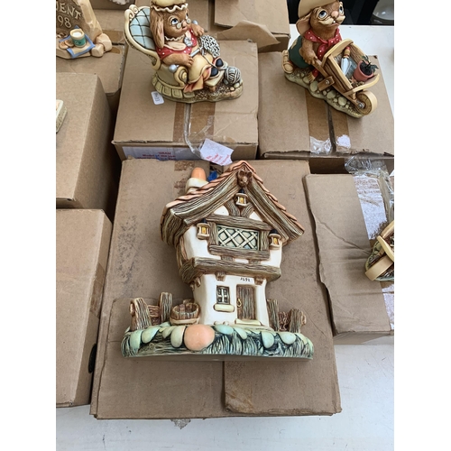 390 - Nine boxed Pendelfin items, one Cottage display stand and eight rabbit figurines to include Gramps, ... 